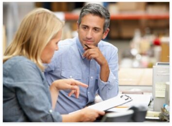 Managers talking in a 3PL warehouse