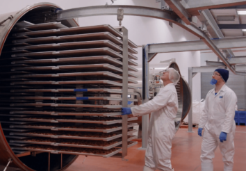 Man loading trays into IFD freeze dryer
